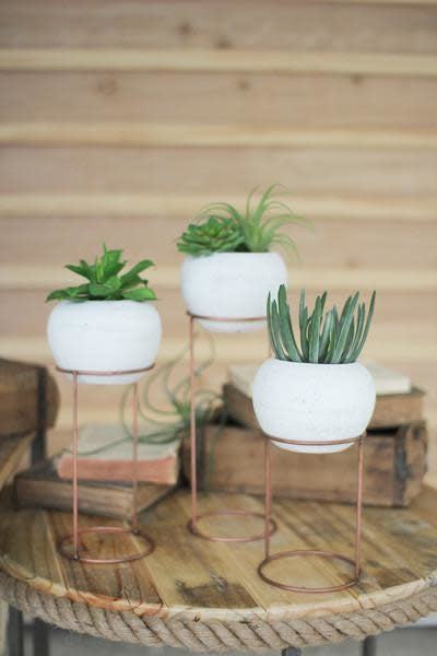 Set Of Three White Clay Vessels On Wire Bases