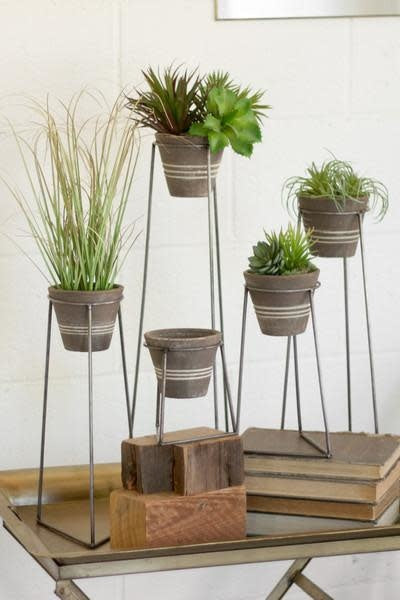 Set Of Five Clay Pots With Wire Bases